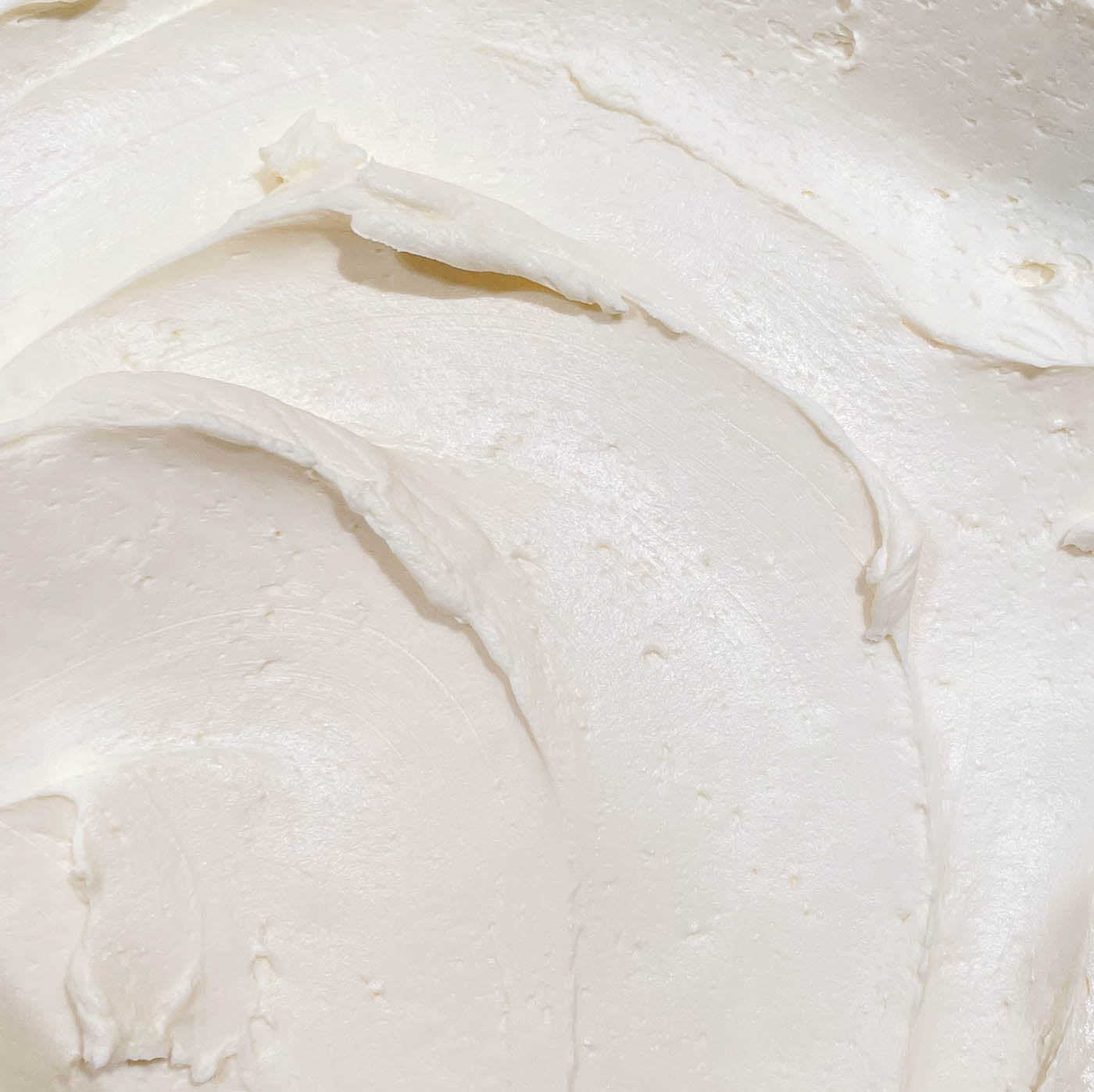Close up shot of fluffy plain whipped cream cheese 